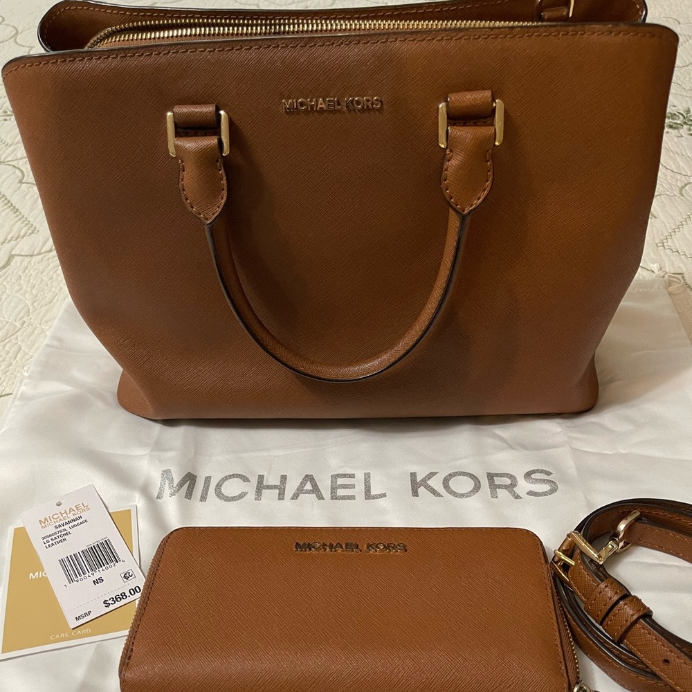Michael Kors, pre loved but still in good condition with matching wallet.